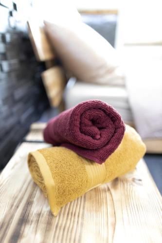 a purple towel sitting on top of a table at L'Air de Musique in Lajoux
