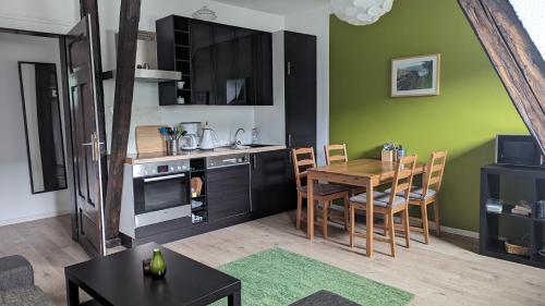 a kitchen with a table and a dining room at Rheinsteig-Ferienwohnungen in Kaub