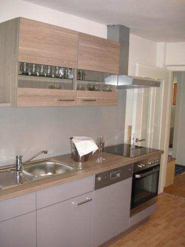 a kitchen with a sink and a counter top at Apartment Nockspitze in Innsbruck