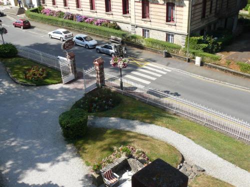 an aerial view of a street with cars on the road at La Villa Bois Joli HOTEL RESTAURANT in Bagnoles de l'Orne