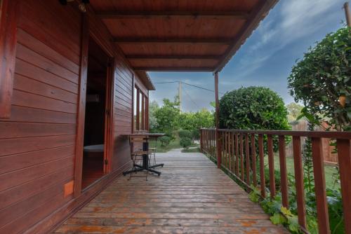 a porch of a house with a table on it at El jardín del Edén in Órgiva