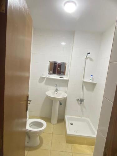 a bathroom with a toilet and a sink at Palemera in Ain Sokhna
