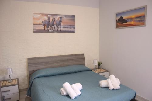 Spiaggia LazzarettoHouseにあるベッド