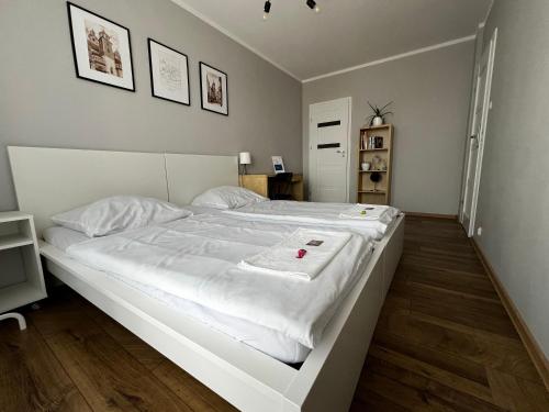 Posteľ alebo postele v izbe v ubytovaní Apartamenty Nila