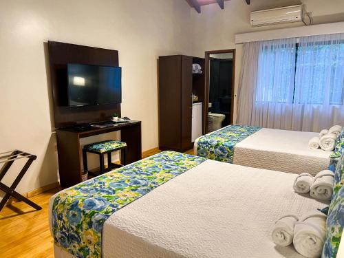 Un ou plusieurs lits dans un hébergement de l'établissement Mburucuyá Hotel Boutique