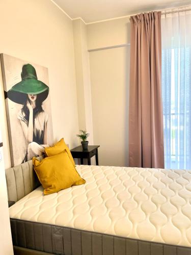 a bedroom with a bed with a hat on the wall at Sonja in Zator