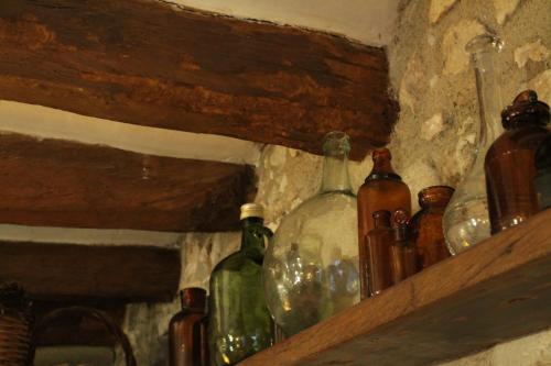 a bunch of glass bottles sitting on a shelf at Cal Blasi in Montblanc