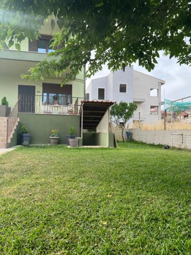 a house with a lawn in front of it at Ioannis Villa in Nea Fokea
