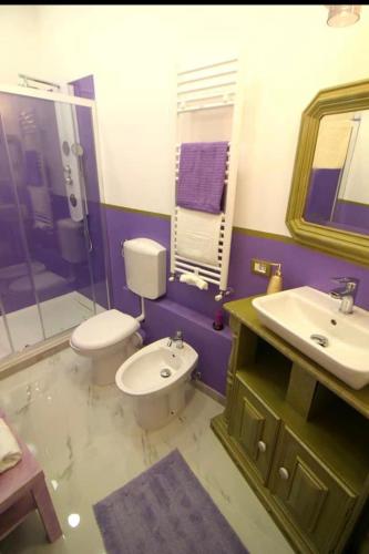 a bathroom with a toilet and a sink at Oceania in Genoa