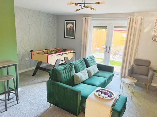 a living room with a couch and a pool table at Comfy Modern 3BR Semi Detached 400Mb Wifi Free Double Parking in Kenton