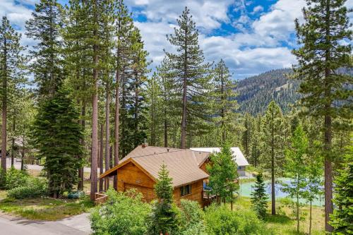 a log cabin in the woods next to a lake at Close to Ski Slopes Tahoe Ski Chalet with Fireplace in Tahoe City