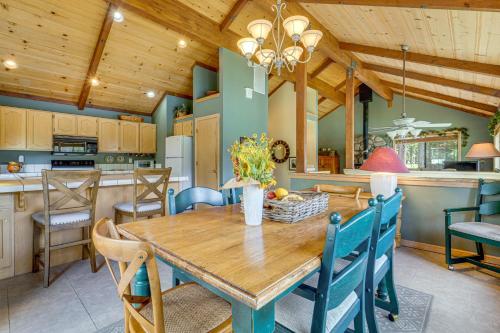 a kitchen and dining room with a wooden table and chairs at Close to Ski Slopes Tahoe Ski Chalet with Fireplace in Tahoe City