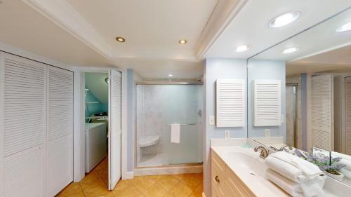 a bathroom with a large sink and a shower at Litchfield Beach & Golf Resort in Pawleys Island