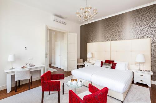 Кровать или кровати в номере Adele Boutique Hotel