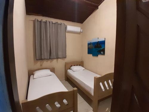 Ένα ή περισσότερα κρεβάτια σε δωμάτιο στο Casa Astral - Praia da Pipa - Casa do Gerson