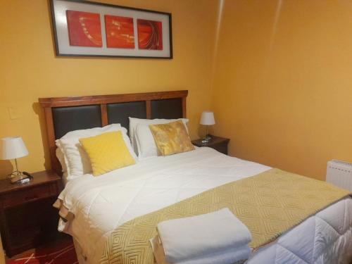 Postel nebo postele na pokoji v ubytování VIP Apartments Chile