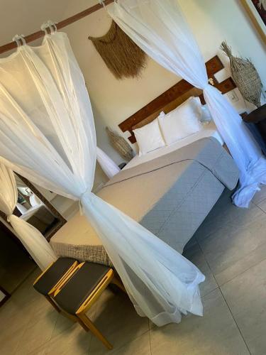 Ein Bett oder Betten in einem Zimmer der Unterkunft Pousada Morro dos Navegantes