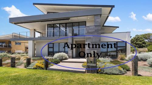a apartment only sign in front of a house at Puesta de Sol Apartment by Wine Coast Holidays in Sellicks Beach