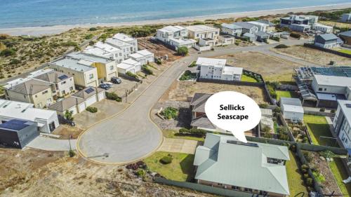 an aerial view of a residential neighbourhood with a sign that reads skills service at Sellicks Seacsape by Wine Coast Holidays in Sellicks Beach