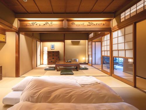 Machiya Hotel oyado baisonにあるベッド
