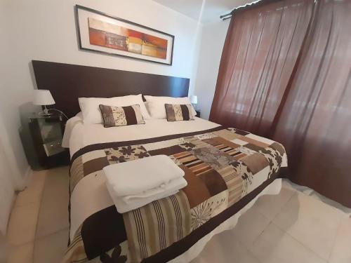 Postel nebo postele na pokoji v ubytování VIP Apartments Chile