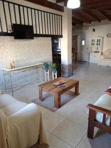 a living room with a couch and a table at La Catalina 2 in San Antonio de Areco