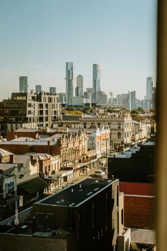 a city view of a city with tall buildings at The Motley Hotel Richmond, Tapestry Collection by Hilton in Melbourne