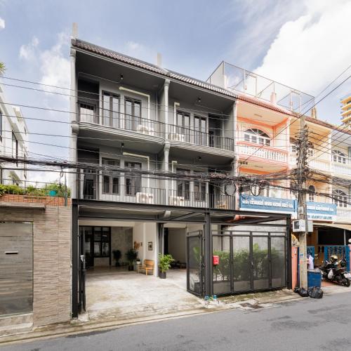 an external view of a building with a balcony at Wabisabi Bangkok 3 MIN To Train Station in Bangkok