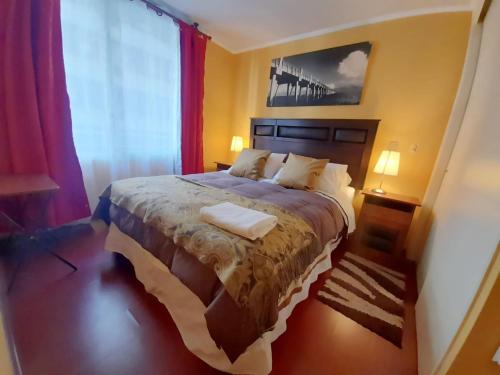 Postel nebo postele na pokoji v ubytování VIP Apartments Chile