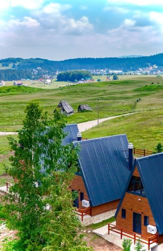 an overhead view of a barn with blue roof at Villas Chardak in Žabljak