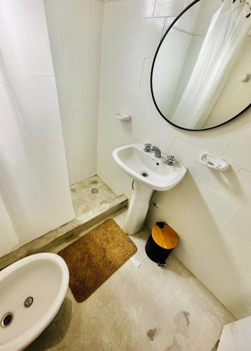 a bathroom with a sink and a mirror at Casita Larraun- tu espacio cálido en la tranquilidad de Navarro in Navarro