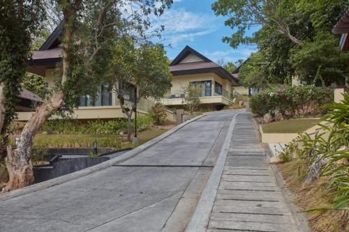 an empty street in front of a house at Two Seasons Coron Island Resort in Coron