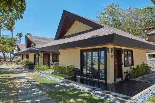 a small house with a pitched roof at Two Seasons Coron Island Resort in Coron
