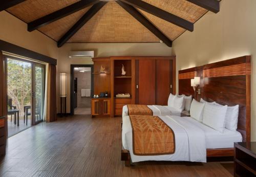 a bedroom with a large bed in a room at Two Seasons Coron Island Resort in Coron