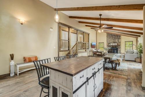 a kitchen with a table and chairs and a living room at Buckskin Hideaway Hiking & Biking Trails BBQ in Monument