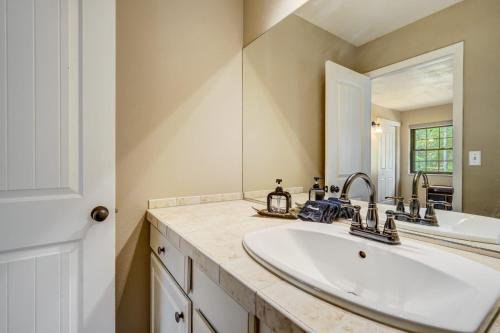 a bathroom with a sink and a mirror at Buckskin Hideaway Hiking & Biking Trails BBQ in Monument