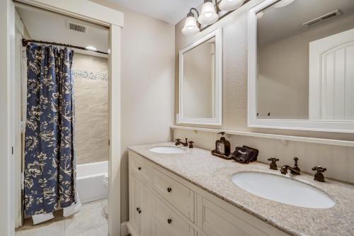 a bathroom with two sinks and a shower at Buckskin Hideaway Hiking & Biking Trails BBQ in Monument