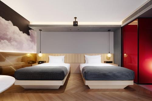 Un ou plusieurs lits dans un hébergement de l'établissement ISEYA Panoramic Hotel Chengdu Tianfu Square, Chunxi Road