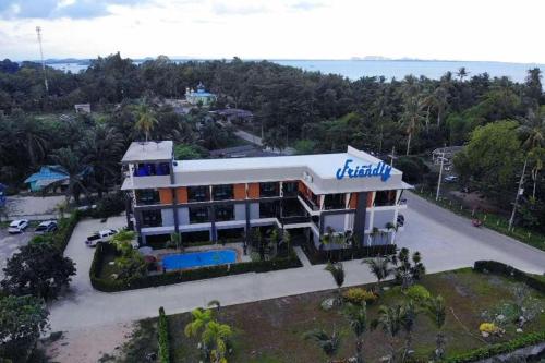 an aerial view of a building with a resort at Friendly Hotel Krabi in Ao Nam Mao