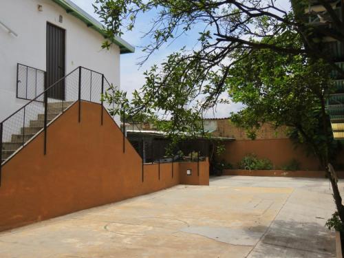 a house with a staircase in a courtyard at Hostal Centro Histórico in Oaxaca City