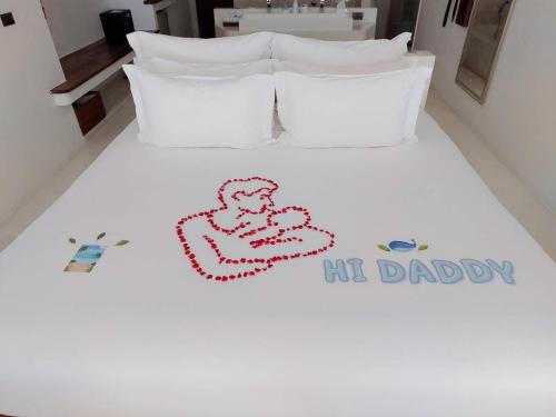 a bed with a nitt daddy written on it at White Whale Beachfront Pool Villa in Ban Bang Po
