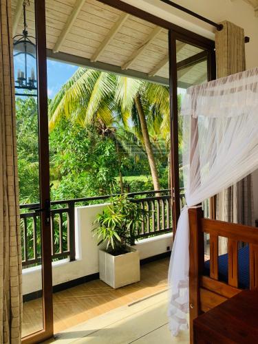 Un balcón o terraza en Mawbima Villa