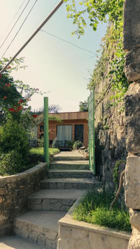 a set of stairs leading up to a building at Garden rooms in Kutaisi in Kutaisi