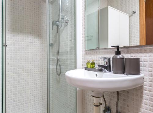 a bathroom with a sink and a shower at Picasso Suites in Barcelona