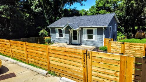 a house behind a wooden fence at Luxury duplex unit in Nashville Unit A in Nashville