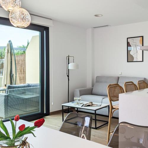 a living room with a couch and a table at ASTER magic dúplex in Villajoyosa