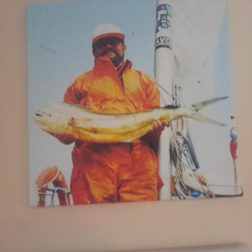 a painting of a man holding a fish at Privat 2 na Sihoti in Trenčín