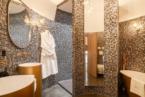 a bathroom with a sink and a mirror at Château de Maraval in Cénac-et-Saint-Julien