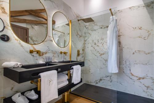 a bathroom with a sink and a mirror at Château de Maraval in Cénac-et-Saint-Julien