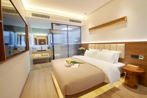 Postel nebo postele na pokoji v ubytování 夕露小榭南门机场大巴店Xiluxiaoxie MUXIN INN